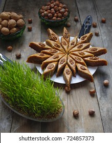 Traditional Azerbaijan Holiday Nowruz Cookies Baklava On White Plate On The Rustic Background With Nuts And Huzelnuts On Green Plate ,flat Lay