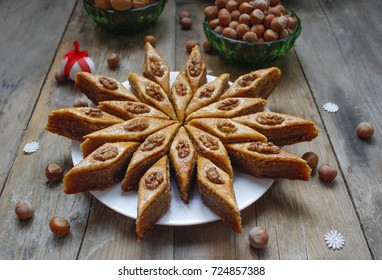 Traditional Azerbaijan Holiday Nowruz Cookies Baklava On White Plate On The Rustic Background With Nuts And Huzelnuts On Green Plate ,flat Lay