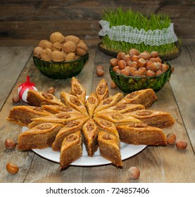 Traditional Azerbaijan Holiday Nowruz Cookies Baklava On White Plate On The Rustic Background With Nuts And Huzelnuts On Green Plate ,flat Lay