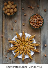 Traditional Azerbaijan Holiday Nowruz Cookies Baklava On White Plate On The Rustic Background With Nuts And Huzelnuts On Green Plate ,flat Lay