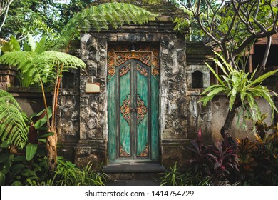 Traditional balinese handmade carved wooden door. Bali style furniture with ornament details - Powered by Shutterstock