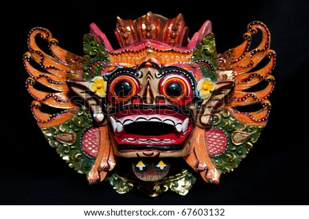 Traditional Balinese mask on a black background.