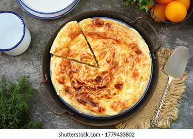 Traditional Balkan filo pastry pie with cottage cheese, sheep’s cheese and yogurt mixed with chicken eggs. Organic healthy food.