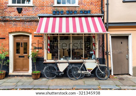 A traditional barber shop with bicycles outside