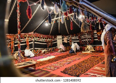 The traditional Bedouin Tent in Saudi Arabia with Arabian people wear traditional clothes