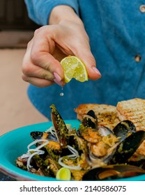 Traditional Belgian Mussels With Lime In A Blue Plate