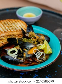 Traditional Belgian Mussels With Lime In A Blue Plate