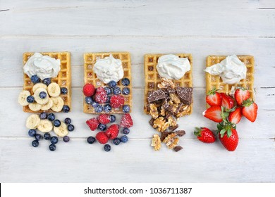 Traditional belgian waffles with fresh fruit and whipped cream - Powered by Shutterstock