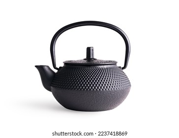 Traditional black asian cast iron kettle or teapot isolated on white background