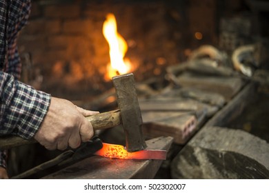 A Traditional Blacksmith Working On A Knife