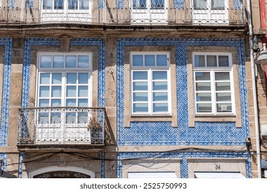 Traditional blue tiles on the facade of an old house in the center of Braga, Portugal - Powered by Shutterstock