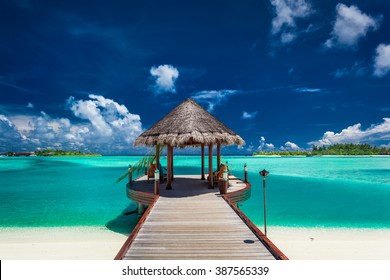 Traditional Boat Jetty In A Luxury Resort Of Maldives, Indian Ocean