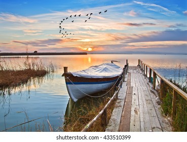 Traditional Boat On The Lake Pier