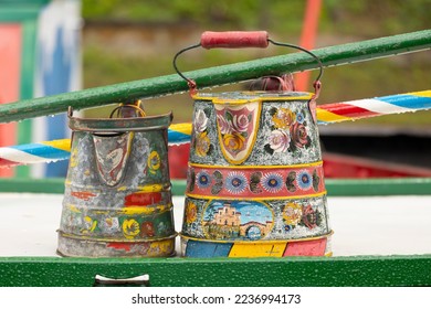 A traditional boater's coal scuttle, painted maybe a century ago, on the roof of a house boat - Shutterstock ID 2236994173
