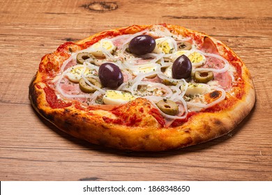 Traditional Brazilian pizza with Portuguese flavor, with mozzarella, eggs, onion, ham and olives on white background. - Powered by Shutterstock