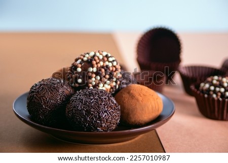 Traditional brazilian sweet chocolate ball Brigadeiro made with cocoa powder and condensed milk
