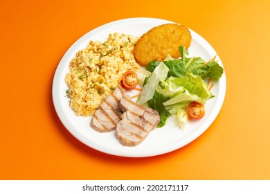 Traditional Breakfast. Fried Eggs, Meat And Hash Brown In A Plate. Selective Focus.