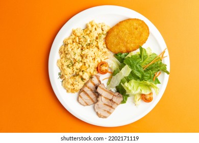 Traditional Breakfast. Fried Eggs, Meat And Hash Brown In A Plate. Selective Focus.