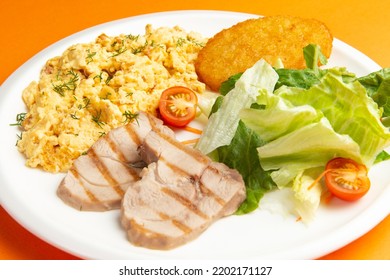 Traditional Breakfast. Fried Eggs, Meat And Hash Brown In A Plate. Selective Focus.