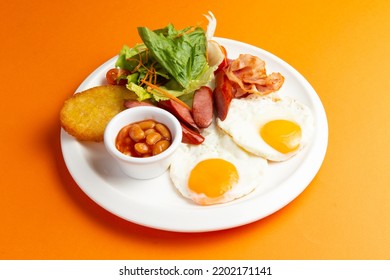 Traditional Breakfast. Fried Sausage Eggs And Hash Brown In A Plate. Selective Focus.