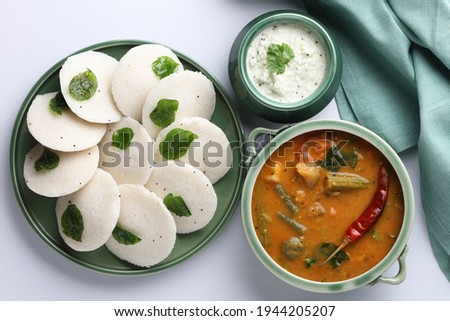 Traditional breakfast of South India IDLY served with sambar  Chutney in a ceramic plate