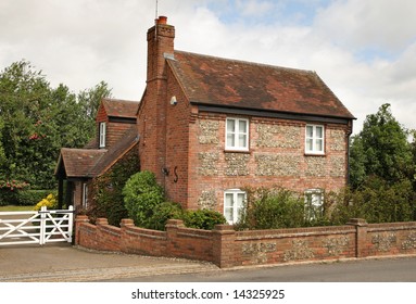 Traditional Brick and Flint Cottage and Garden in a Rural English Village