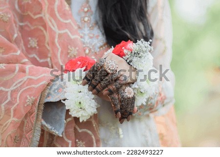 Traditional bride with beautiful henna on hand