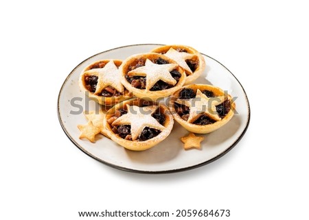 Traditional British Christmas pastry Mince Pies with apple, raisins, nuts filling. Isolated on white background Stock photo © 