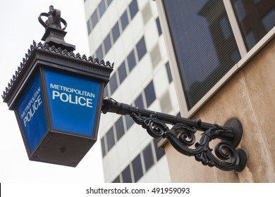 Traditional British Metropolitan Police lamp sign outside police station, London, England - Shutterstock ID 491959093