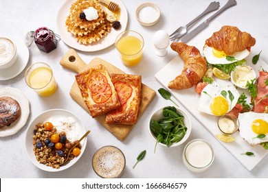 Traditional Brunch. Healthy Sunday Breakfast With Croissants, Waffles, Eggs, Granola And Sandwiches. Flatlay With Tasty Food