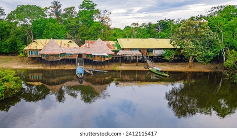 Traditional cabins, lush vegetation in Leticia, Amazonas, Colombia - Powered by Shutterstock