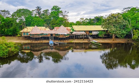 Traditional cabins, lush vegetation in Leticia, Amazonas, Colombia  - Powered by Shutterstock