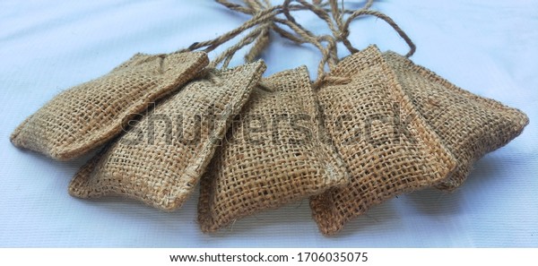 traditional car air freshener, made from coffe beans
and gunny sack