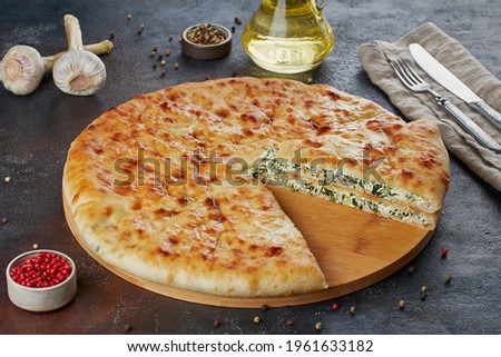 Traditional Caucasian dish - Ossetian pies with cheese, potatoes, herbs, cottage cheese, cherries, beef, mushrooms, dark background Stock photo © 