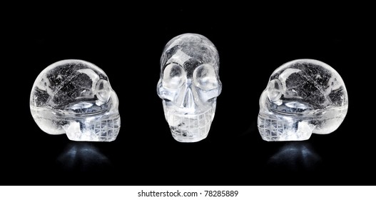 Traditional Central American Quartz Crystal Carved Skulls, Isolated On Black.