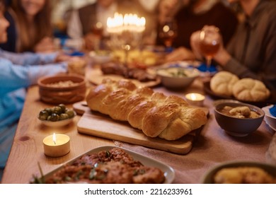 Traditional Challah Bread During Family Dinner On Hanukkah.