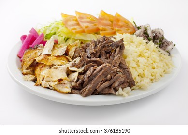 Traditional  Chicken And Beef Gyro Platter With All The Fixings On White Dish, Part Of A Greek, Mediterranean Or Middle Eastern Diet, 