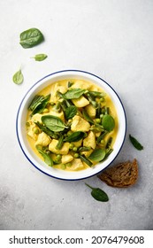 Traditional chicken curry with green pea and spinach