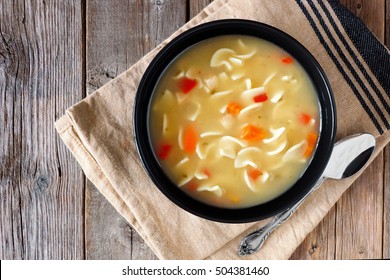 Traditional Chicken Noodle Soup, Above Scene On A Rustic Wooden Background