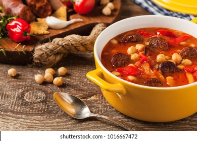 Traditional Chickpea Soup With Paprika And Chorizo Sausage. Front View.