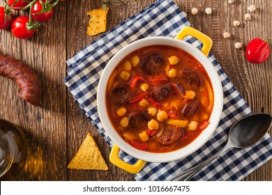 Traditional Chickpea Soup With Paprika And Chorizo Sausage. Top View.