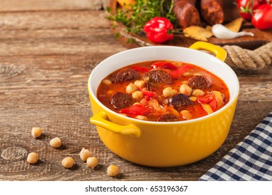 Traditional Chickpea Soup With Paprika And Chorizo Sausage. Front View.