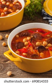 Traditional Chickpea Soup With Paprika And Chorizo Sausage. Front View.