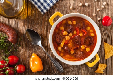 Traditional Chickpea Soup With Paprika And Chorizo Sausage. Top View.