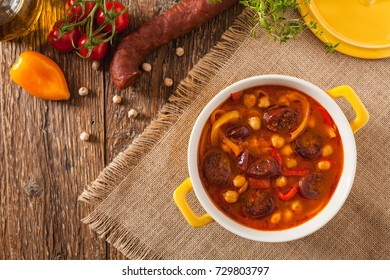 Traditional Chickpea Soup With Paprika And Chorizo Sausage. Top View.