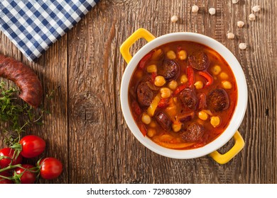 Traditional Chickpea Soup With Paprika And Chorizo Sausage. Top View.