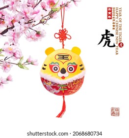 Traditional Chinese cloth doll tiger,2022 is year of the tiger,Chinese characters mean: "tiger".Rightside chinese wording and seal mean:Chinese calendar for the year.underside seal mean: good bless.