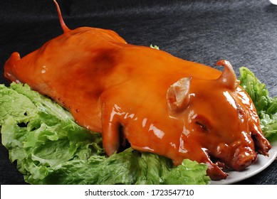Traditional Chinese cuisine: Roast suckling pig - Shutterstock ID 1723547710