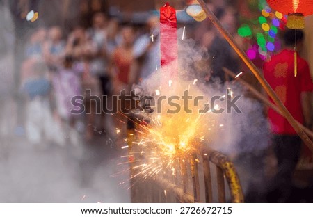 Traditional chinese firecrackers are exploding with flashes and smoke in Lunar new year.