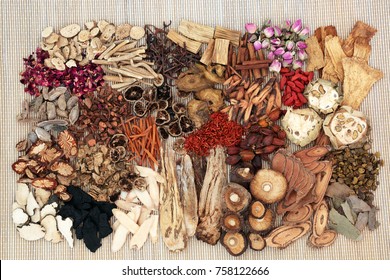 Traditional Chinese Herbs Used In Alternative Herbal Medicine On Bamboo Background. Top View.